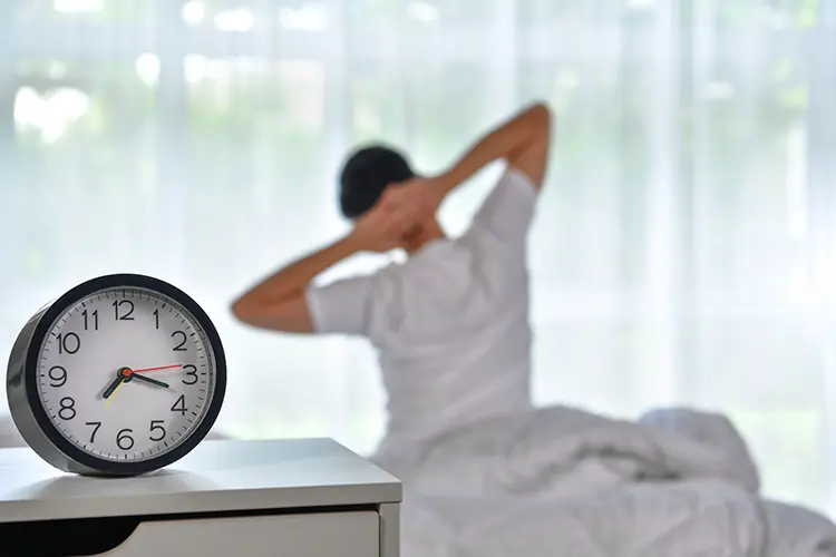 Alarm clock showing the importance of consistent wake time for circadian rhythm