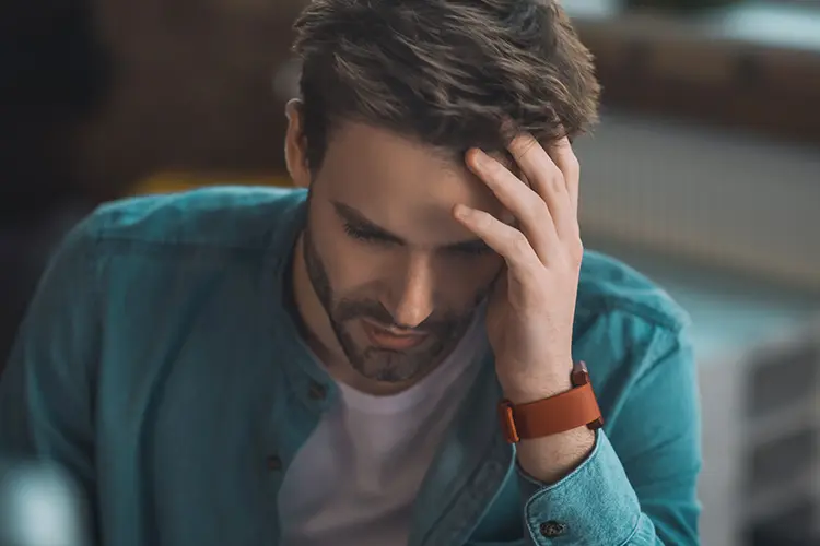 Man struggling with brain fog at his desk